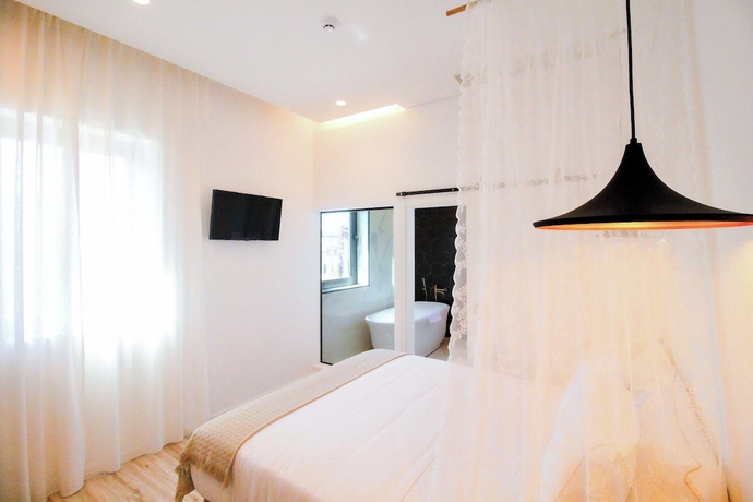 Imagen de la habitación del Hotel The Lost Garden. Foto 5