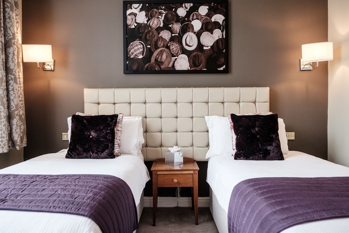 Imagen de la habitación del Hotel The Mad Hatter. Foto 3