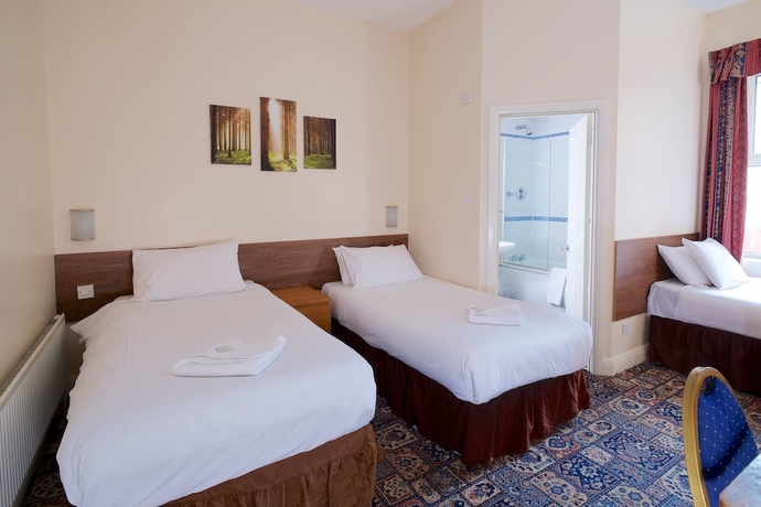 Imagen de la habitación del Hotel The Maemar. Foto 3