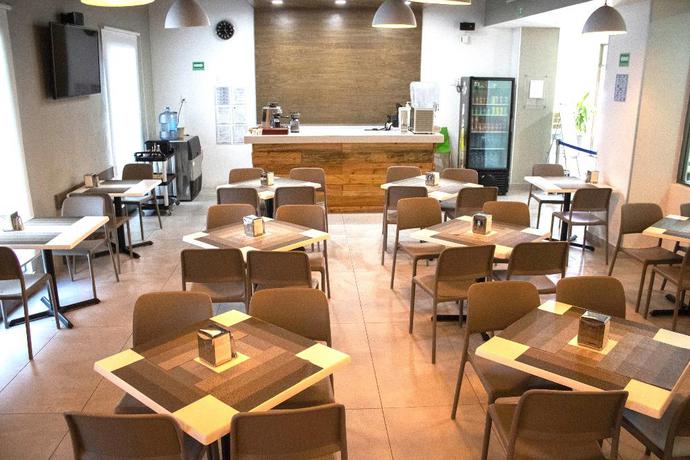 Imagen del bar/restaurante del Hotel The Magic. Foto 6