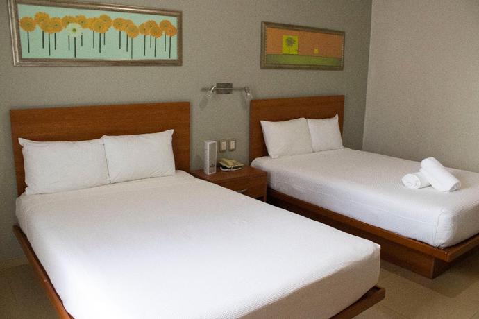 Imagen de la habitación del Hotel The Magic. Foto 12