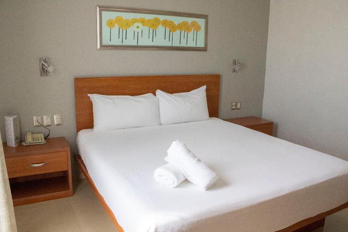 Imagen de la habitación del Hotel The Magic. Foto 14