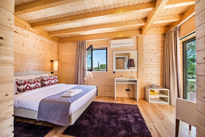 Imagen de la habitación del Hotel The Magnolia. Foto 11