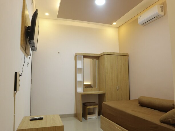 Imagen de la habitación del Hotel The Maguwo Premiere Kost Ekslusif. Foto 13