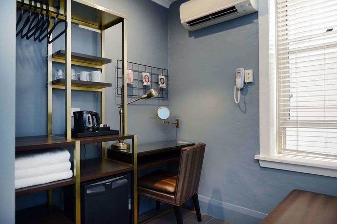 Imagen de la habitación del Hotel The Maisonette. Foto 2