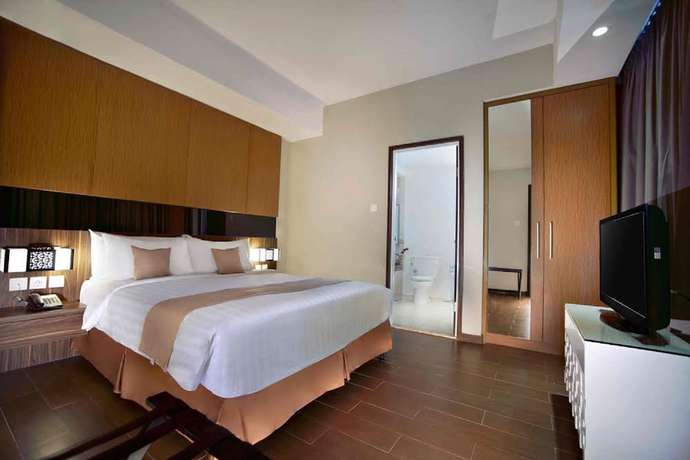 Imagen de la habitación del Hotel The Malibu Suites Balikpapan By Sissae Living. Foto 15