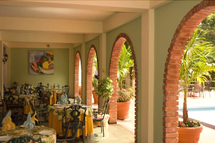 Imagen del bar/restaurante del Hotel The Mandeville, Mandeville. Foto 3