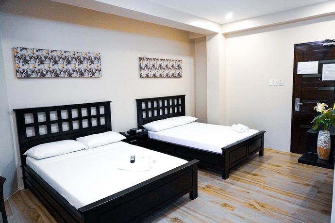 Imagen de la habitación del Hotel The Mang-Yan Grand Hotel by Cocotel. Foto 11