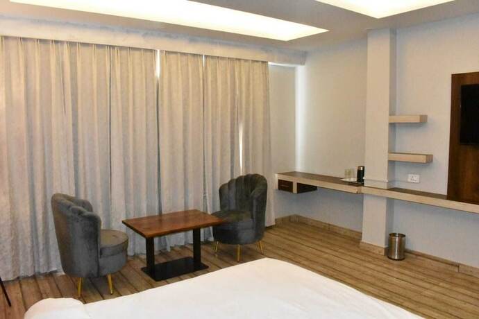 Imagen de la habitación del Hotel The Mango Tree. Foto 14