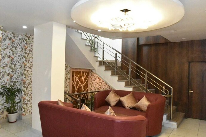 Imagen de la habitación del Hotel The Mango Tree. Foto 16