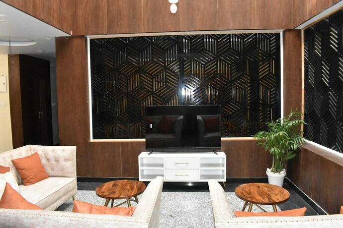 Imagen de la habitación del Hotel The Mango Tree. Foto 17