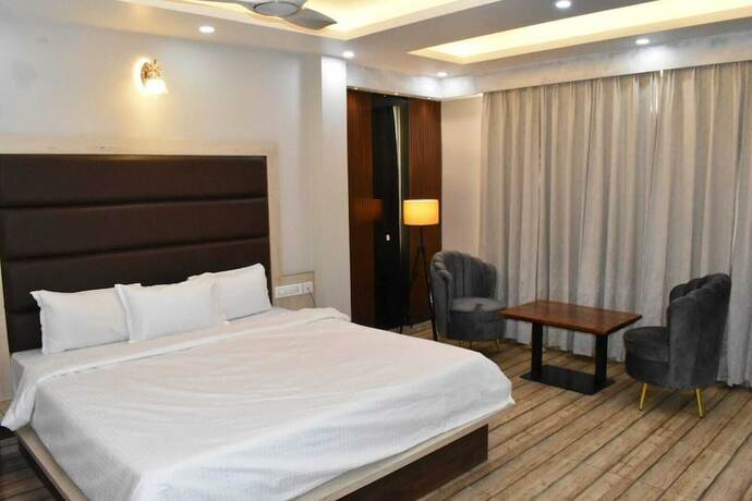 Imagen de la habitación del Hotel The Mango Tree. Foto 18