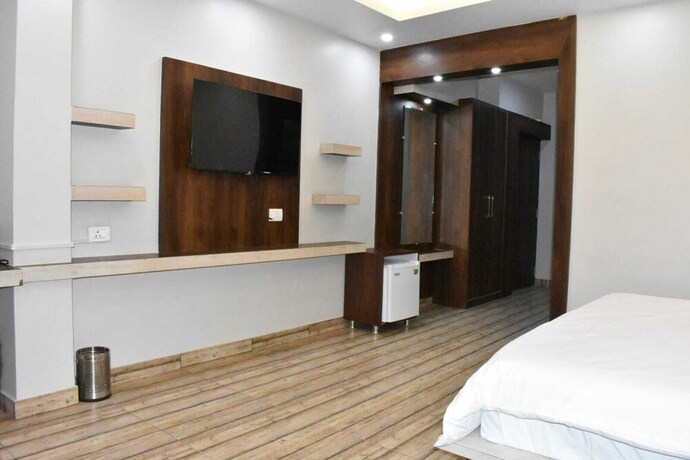 Imagen de la habitación del Hotel The Mango Tree. Foto 21