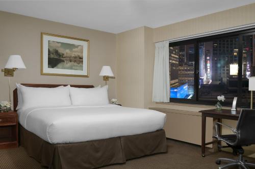 Imagen de la habitación del Hotel The Manhattan at Times Square. Foto 12
