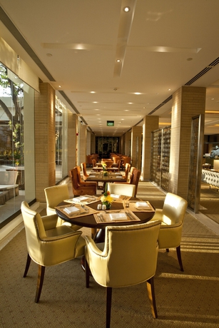 Imagen del bar/restaurante del Hotel The Manila. Foto 9