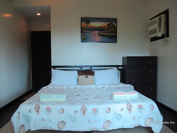 Imagen de la habitación del Hotel The Manor At Puerto Galera. Foto 7