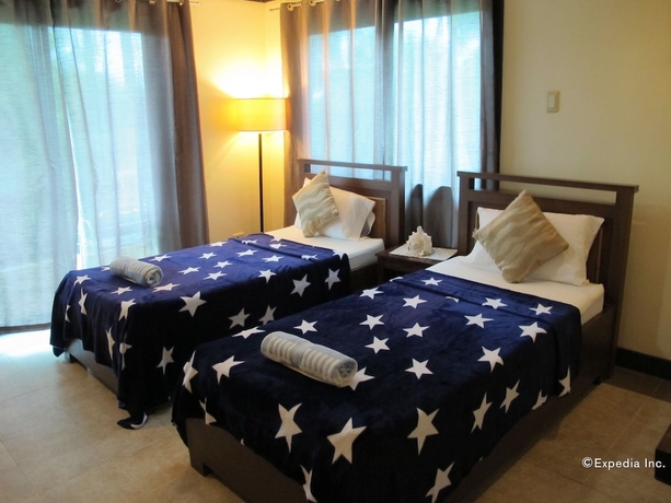 Imagen de la habitación del Hotel The Manor At Puerto Galera. Foto 19