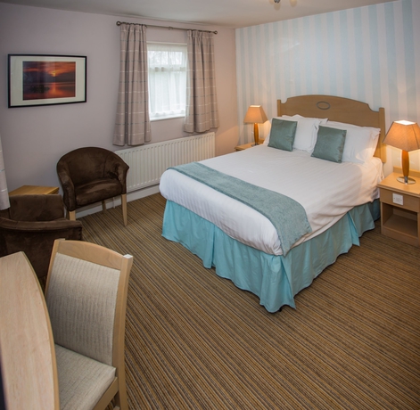 Imagen de la habitación del Hotel The Manor Guesthouse. Foto 5