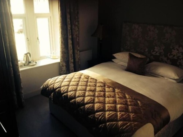 Imagen de la habitación del Hotel The Mansion House Hotel. Foto 6