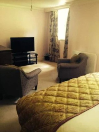 Imagen de la habitación del Hotel The Mansion House Hotel. Foto 13