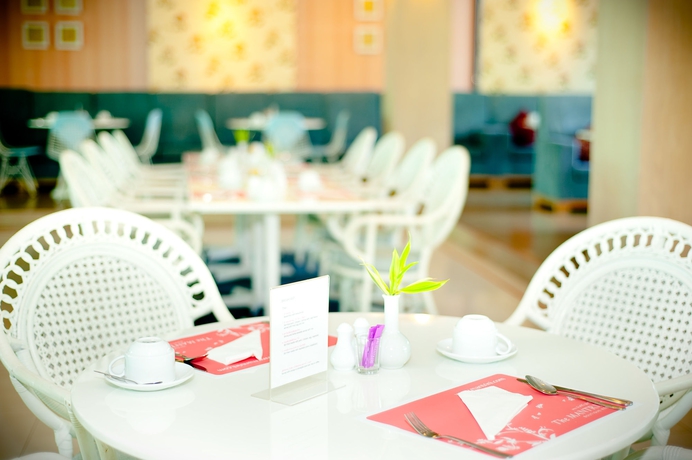 Imagen del bar/restaurante del Hotel The Mantrini Chiang Rai. Foto 2