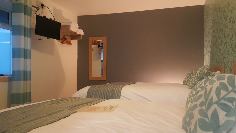 Imagen de la habitación del Hotel The Maple. Foto 12