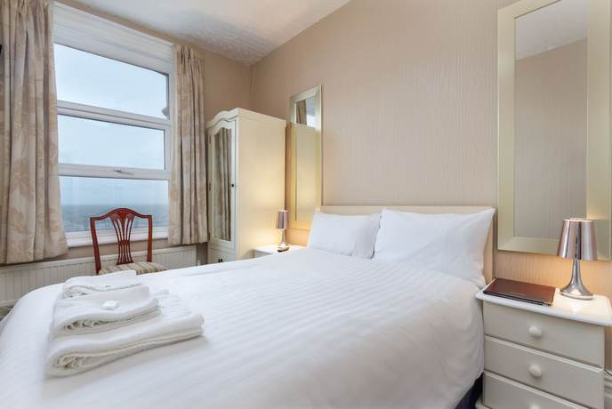 Imagen de la habitación del Hotel The Maples. Foto 7