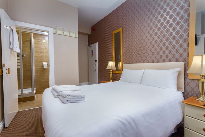 Imagen de la habitación del Hotel The Maples. Foto 16
