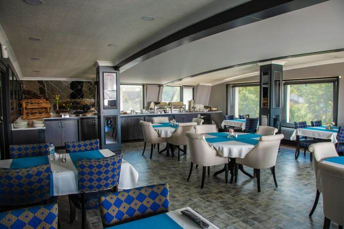Imagen del bar/restaurante del Hotel The Mara Palace Otel. Foto 5