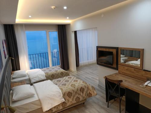 Imagen de la habitación del Hotel The Marine, Yeşilyalı. Foto 16