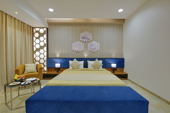 Imagen de la habitación del Hotel The Maruti Nandan Grand. Foto 7