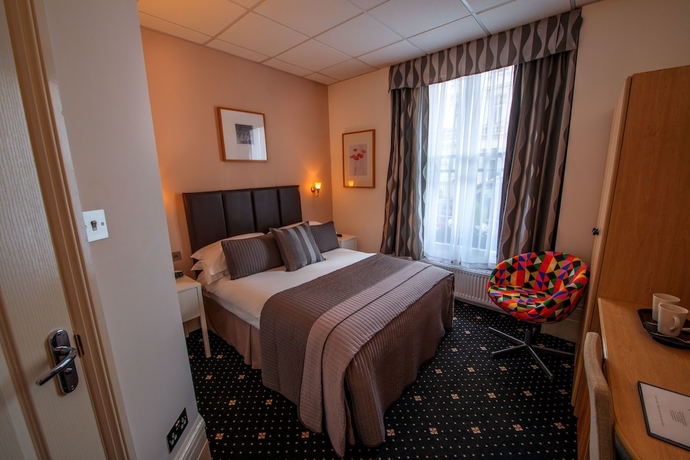 Imagen de la habitación del Hotel The Melita. Foto 6