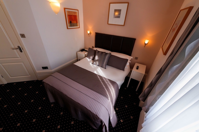 Imagen de la habitación del Hotel The Melita. Foto 9