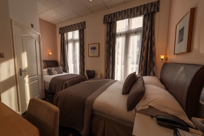 Imagen de la habitación del Hotel The Melita. Foto 14