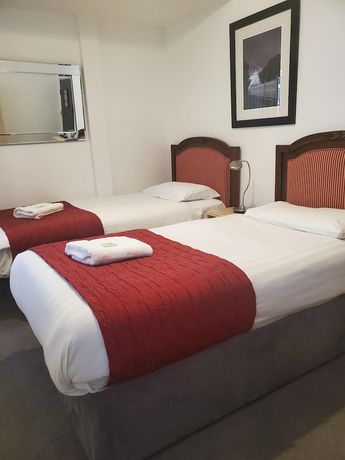 Imagen de la habitación del Hotel The Melville. Foto 10