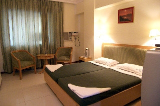Imagen de la habitación del Hotel The Menino Regency. Foto 3