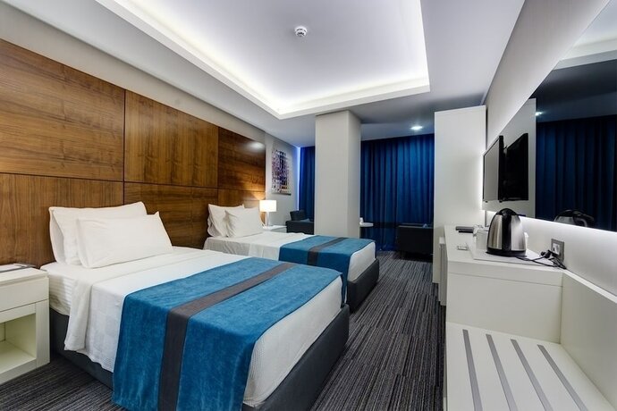 Imagen de la habitación del Hotel The Menord. Foto 18