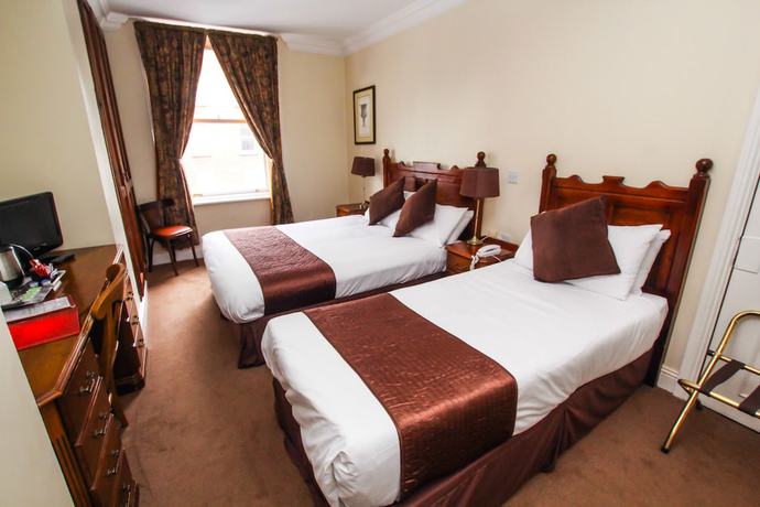 Imagen de la habitación del Hotel The Mercantile. Foto 17