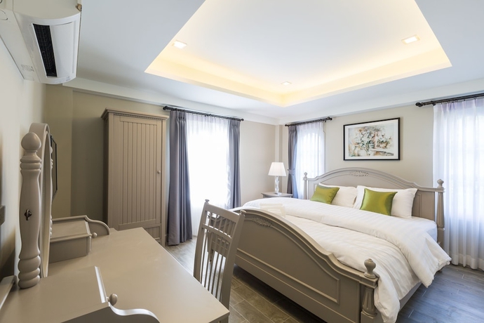 Imagen de la habitación del Hotel The Merchant House Chiangmai. Foto 2