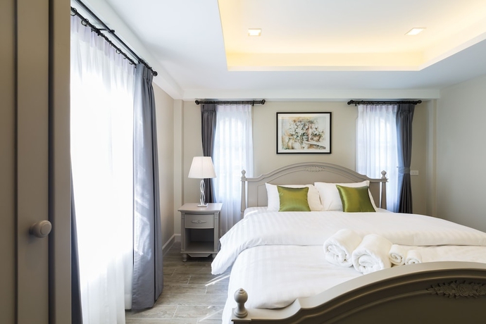 Imagen de la habitación del Hotel The Merchant House Chiangmai. Foto 3
