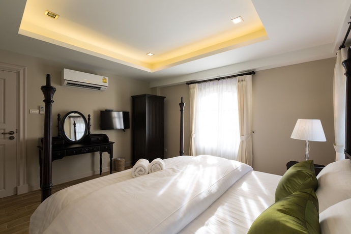 Imagen de la habitación del Hotel The Merchant House Chiangmai. Foto 12