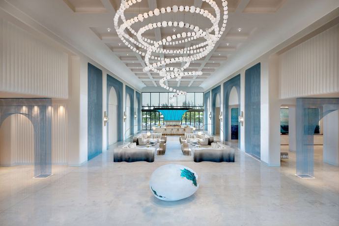 Imagen de los interiores del Hotel The Mermoon Resort Hainan Tufu Bay, Tapestry By Hilton. Foto 13