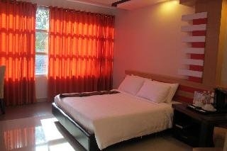 Imagen de la habitación del Hotel The Metropolis Suites Davao. Foto 7