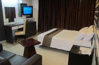 Imagen de la habitación del Hotel The Metropolis Suites Davao. Foto 8