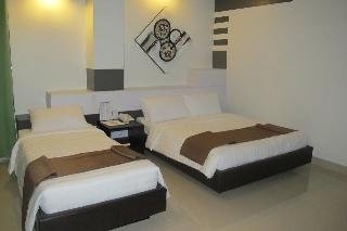 Imagen de la habitación del Hotel The Metropolis Suites Davao. Foto 13