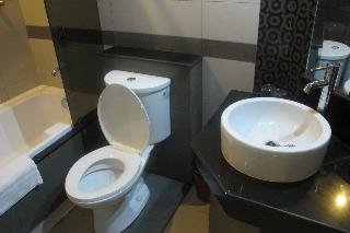 Imagen de la habitación del Hotel The Metropolis Suites Davao. Foto 14