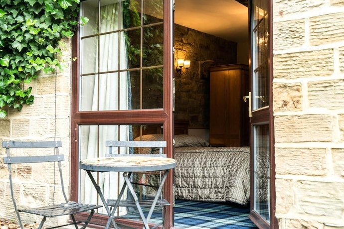 Imagen de la habitación del Hotel The Mews. Foto 16