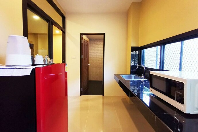 Imagen de la habitación del Hotel The Middle Town Sha. Foto 17
