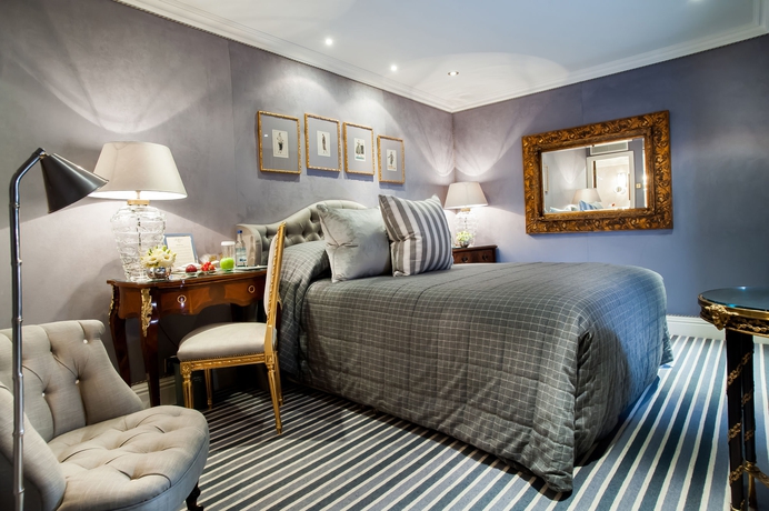 Imagen de la habitación del Hotel The Milestone. Foto 10