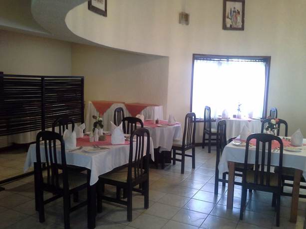Imagen del bar/restaurante del Hotel The Milimani Lodge. Foto 5